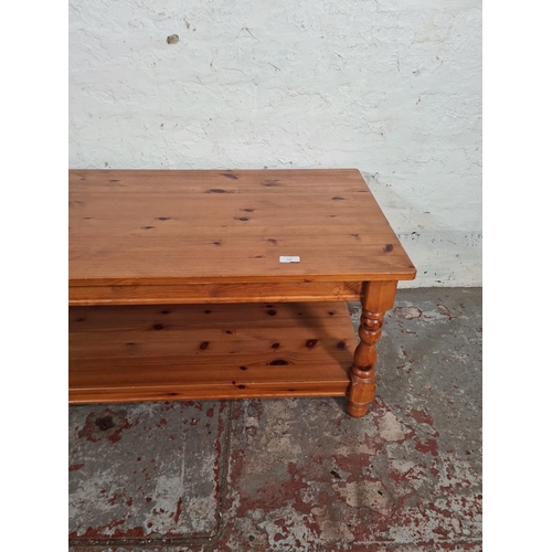 114 - A modern pine rectangular two tier coffee table - approx. 46.5cm high x 55cm wide x 105cm long