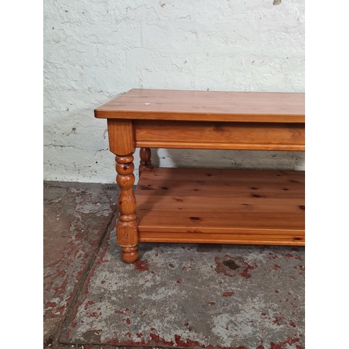 114 - A modern pine rectangular two tier coffee table - approx. 46.5cm high x 55cm wide x 105cm long