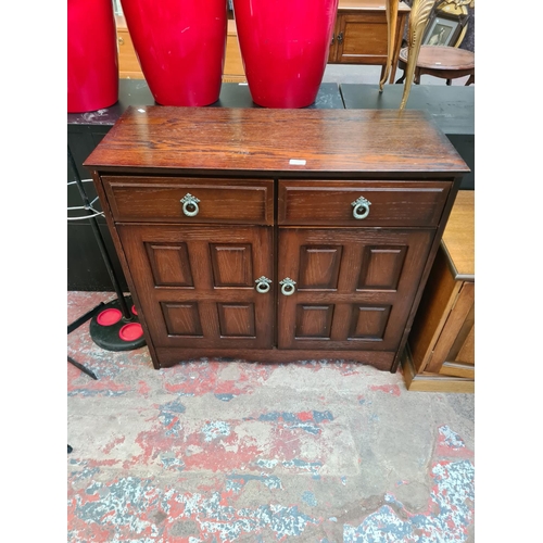 116 - An oak sideboard with two drawers and two cupboard doors - approx. 82.5cm high x 92cm wide x 40cm de... 