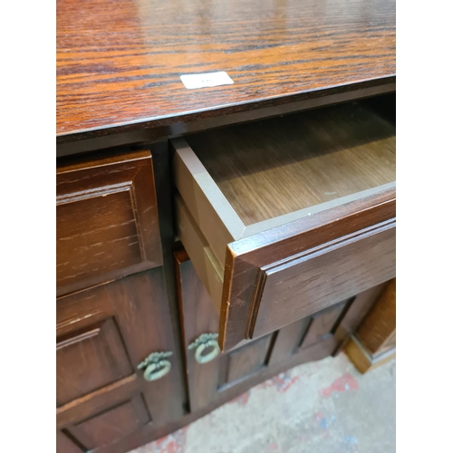 116 - An oak sideboard with two drawers and two cupboard doors - approx. 82.5cm high x 92cm wide x 40cm de... 