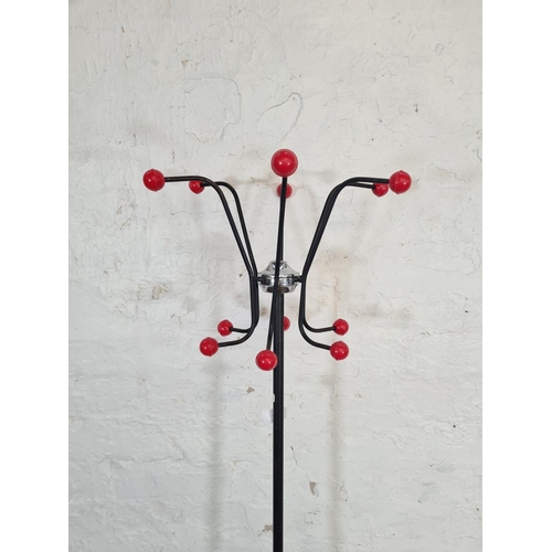 117 - A 1960s Hago black metal and red plastic atomic coat stand - approx. 170cm high