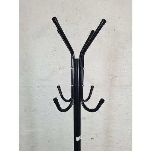 119 - A mid 20th century style black metal coat stand - approx. 172cm high