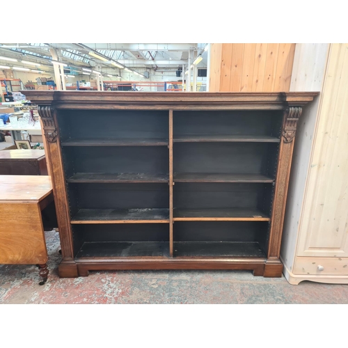 12 - A 19th century rosewood inverted breakfront open bookcase - approx. 145cm high x 185cm wide x 37cm d... 