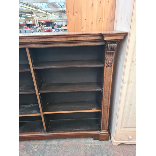 12 - A 19th century rosewood inverted breakfront open bookcase - approx. 145cm high x 185cm wide x 37cm d... 