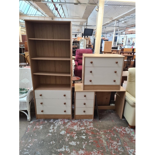 130 - Three pieces of oak effect and white laminate furniture, one chest of drawers, one dressing table an... 