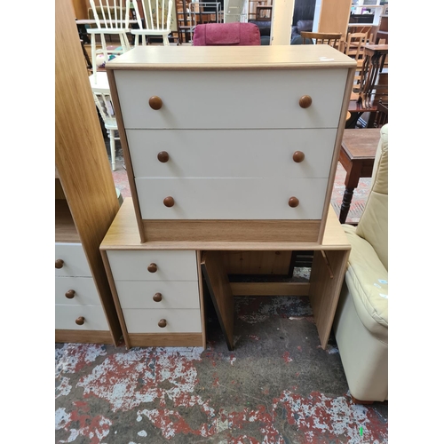 130 - Three pieces of oak effect and white laminate furniture, one chest of drawers, one dressing table an... 