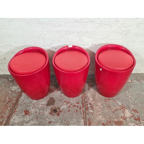 132 - Three Wenko red plastic and leatherette bathroom storage stools - approx. 50cm high