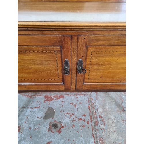 136 - An Edwardian inlaid mahogany two door wash stand - approx. 80cm high x 103cm wide x 47cm deep