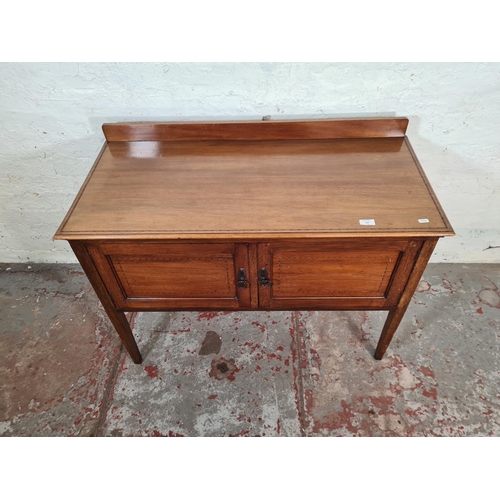 136 - An Edwardian inlaid mahogany two door wash stand - approx. 80cm high x 103cm wide x 47cm deep