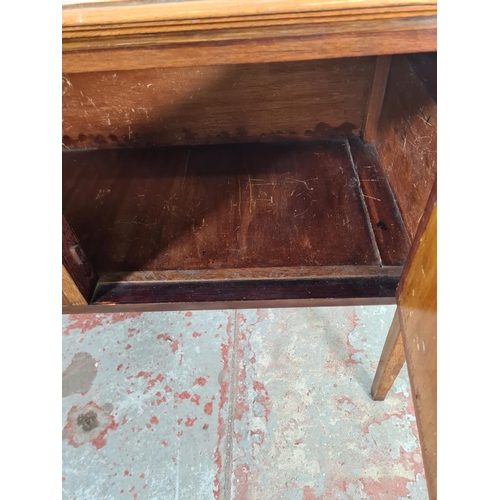 136 - An Edwardian inlaid mahogany two door wash stand - approx. 80cm high x 103cm wide x 47cm deep