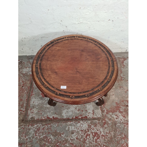 136A - An Anglo Indian style carved mahogany circular side table - approx. 41cm high x 69cm diameter