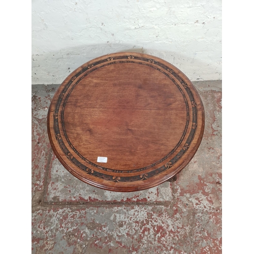 136A - An Anglo Indian style carved mahogany circular side table - approx. 41cm high x 69cm diameter