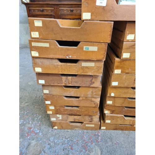 142 - Nineteen mid 20th century beech haberdashery drawers