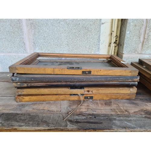 147 - An early 20th century oak twenty four section barristers bookcase - approx. 131cm high x 310cm wide ... 