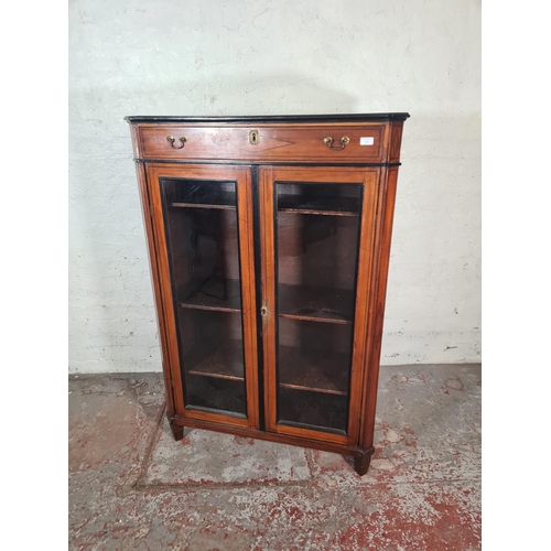 16 - A 19th century ebony inlaid mahogany two door glazed bookcase with three internal shelves and upper ... 