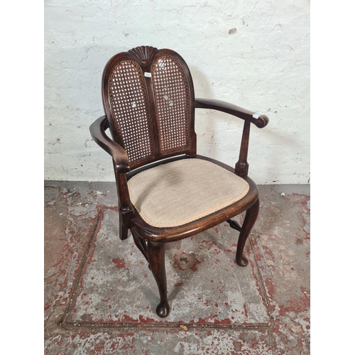 18 - A mid 20th century beech and rattan bergere armchair - approx. 77cm high x 53cm wide x 41cm deep