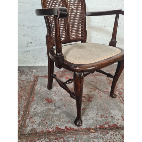 18 - A mid 20th century beech and rattan bergere armchair - approx. 77cm high x 53cm wide x 41cm deep