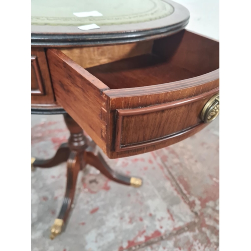 20 - A Regency style mahogany and green leather drum table - approx. 61cm high x 50cm diameter