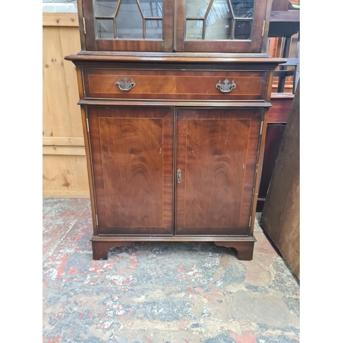 29 - A Georgian style mahogany bookcase with two upper astral glazed doors, single drawer and two lower c... 