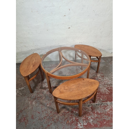 37 - A Nathan teak and glass Trinity coffee table with three nesting tables - approx. 51cm high x 82cm di... 