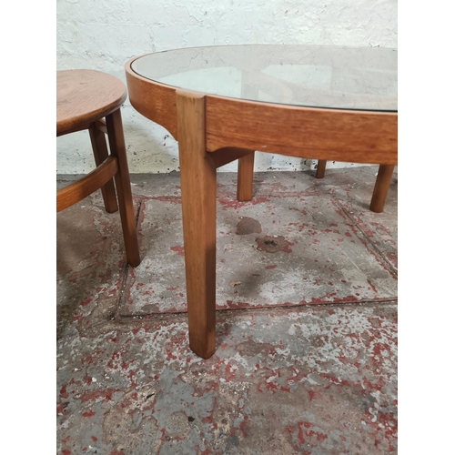 37 - A Nathan teak and glass Trinity coffee table with three nesting tables - approx. 51cm high x 82cm di... 