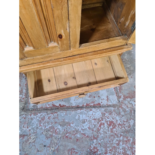 38 - A modern pine two door cabinet with two lower drawers - approx. 119cm high x 70cm wide x 44cm deep