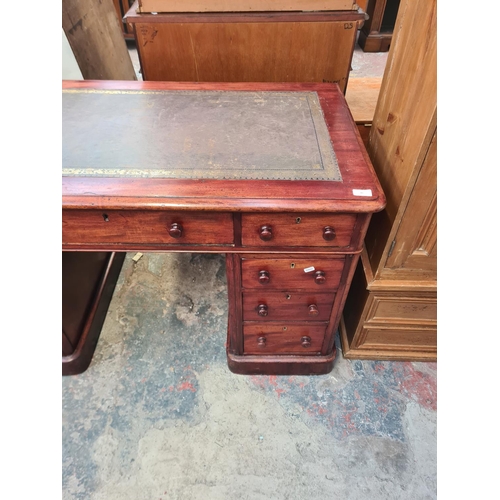 40 - A Victorian mahogany pedestal desk with green leather insert - approx. 75cm high x 121cm wide x 65cm... 