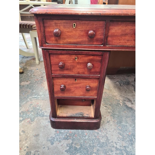 40 - A Victorian mahogany pedestal desk with green leather insert - approx. 75cm high x 121cm wide x 65cm... 