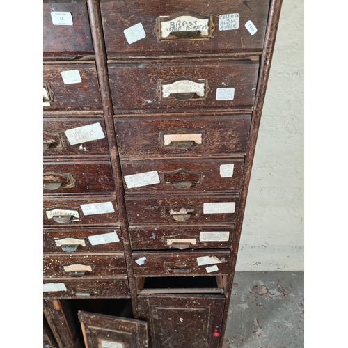 43 - An early 20th century oak thirty drawer haberdashery cabinet - approx. 180cm high x 104cm wide x 41c... 