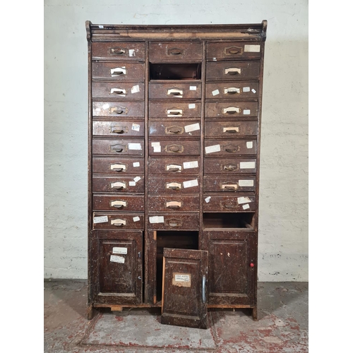 43 - An early 20th century oak thirty drawer haberdashery cabinet - approx. 180cm high x 104cm wide x 41c... 