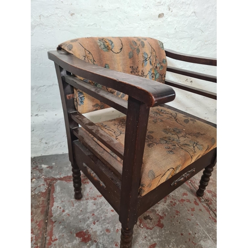 45 - An early 20th century oak and floral upholstered height adjustable armchair - approx. 68cm high x 57... 