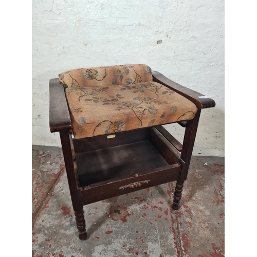 45 - An early 20th century oak and floral upholstered height adjustable armchair - approx. 68cm high x 57... 