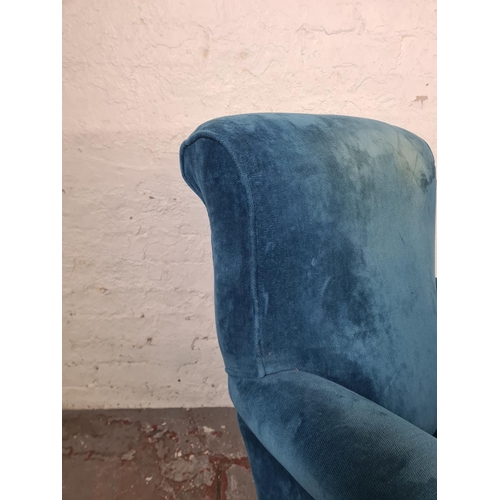 46 - A Victorian blue fabric upholstered armchair with mahogany supports and castors - approx. 96cm high ... 