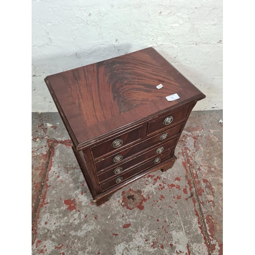 55 - A Regency style mahogany miniature chest of two short over three long drawers - approx. 52cm high x ... 