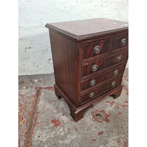 55 - A Regency style mahogany miniature chest of two short over three long drawers - approx. 52cm high x ... 