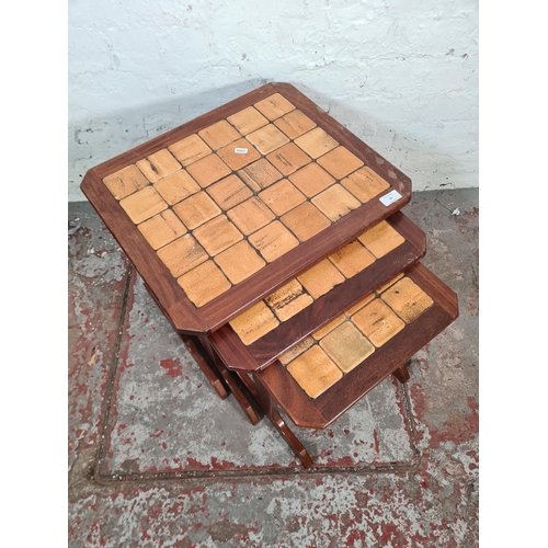 56 - A G Plan teak and tiled top nest of three tables