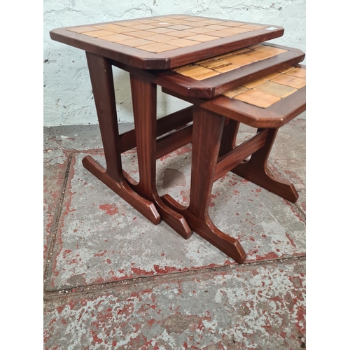 56 - A G Plan teak and tiled top nest of three tables