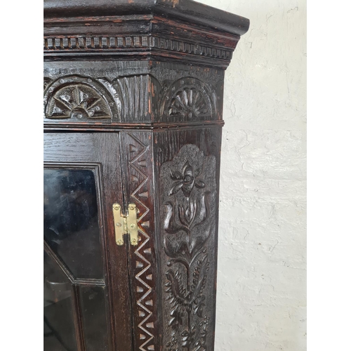 58 - A Victorian Jacobean revival heavily carved oak corner display cabinet - approx. 171cm high x 82cm w... 