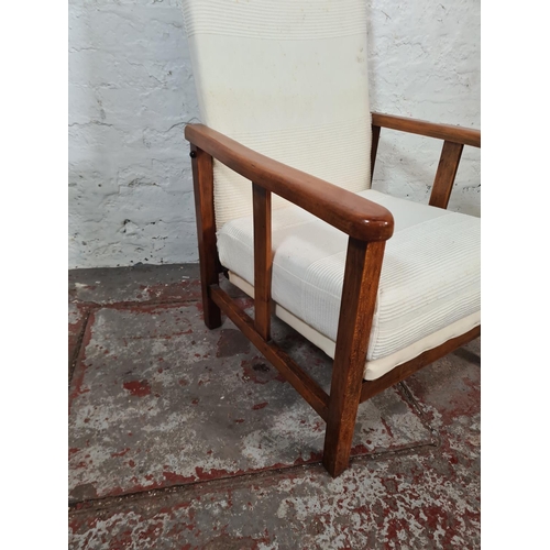 62 - A mid 20th century beech and white fabric upholstered reclining armchair