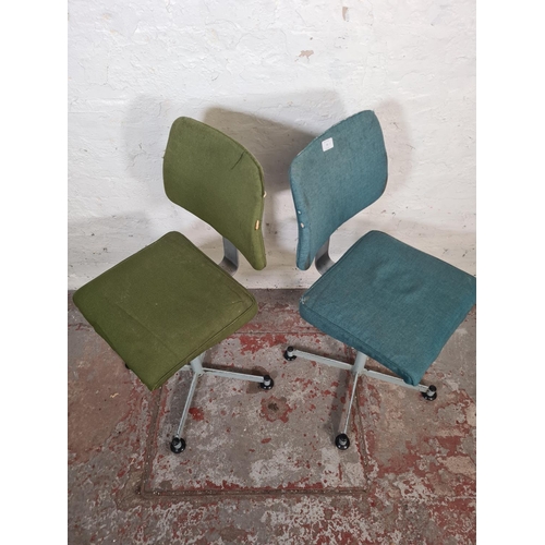 65 - A pair of mid 20th century steel and fabric upholstered swivel desk chairs