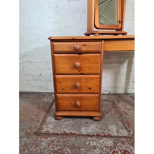 70 - A Westminster pine dressing table with four drawers and mirror - approx. 74cm high x 101cm wide x 45... 