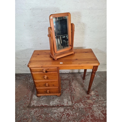 70 - A Westminster pine dressing table with four drawers and mirror - approx. 74cm high x 101cm wide x 45... 