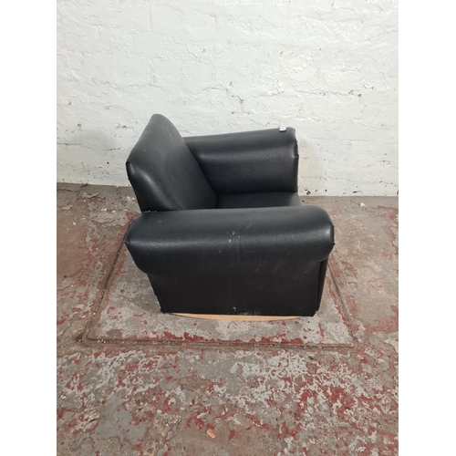 88 - A modern black leatherette child's rocking armchair - approx. 45cm high x 64cm wide x 46cm deep