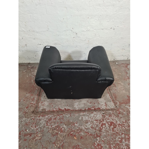 88 - A modern black leatherette child's rocking armchair - approx. 45cm high x 64cm wide x 46cm deep