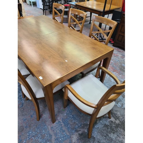 94 - A modern walnut rectangular extending dining table and eight matching chairs - approx. 75.7cm high x... 