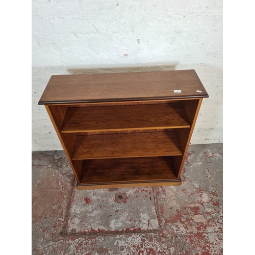 95 - A modern oak effect three tier open bookcase - approx. 98cm high x 91cm wide x 28cm deep