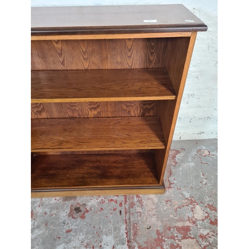 95 - A modern oak effect three tier open bookcase - approx. 98cm high x 91cm wide x 28cm deep