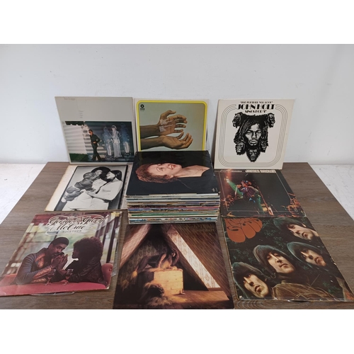 781A - A collection of LP vinyl records to include Kate Bush 'Lionheart', John Holt, The Beatles 'Rubber So... 