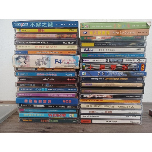 783 - A collection of Chinese Video CDs and world music CD albums - see images for titles