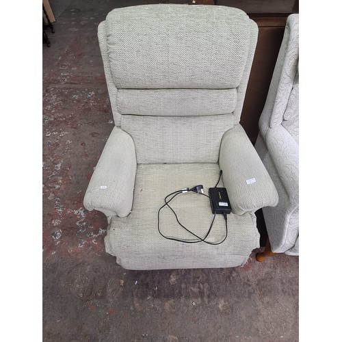 127B - A Sherborne green fabric upholstered electric reclining armchair with remote and power adaptor